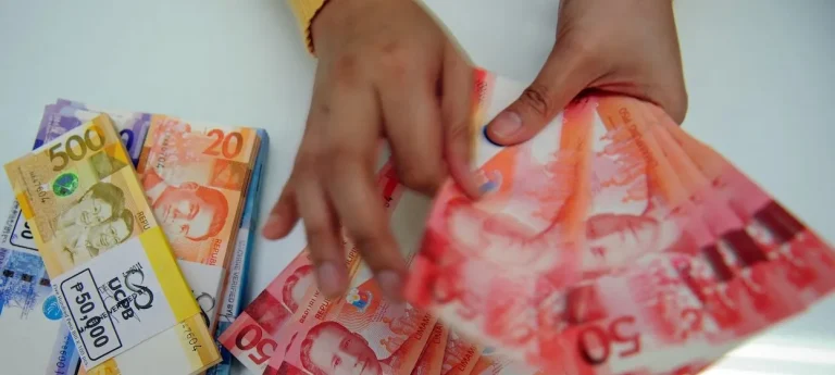 The Philippine economy’s strength has long been associated with robust inflows of remittances from overseas Filipinos, but its contribution to the Philippine economy has waned over time. (Photo by TED ALJIBE / AFP)